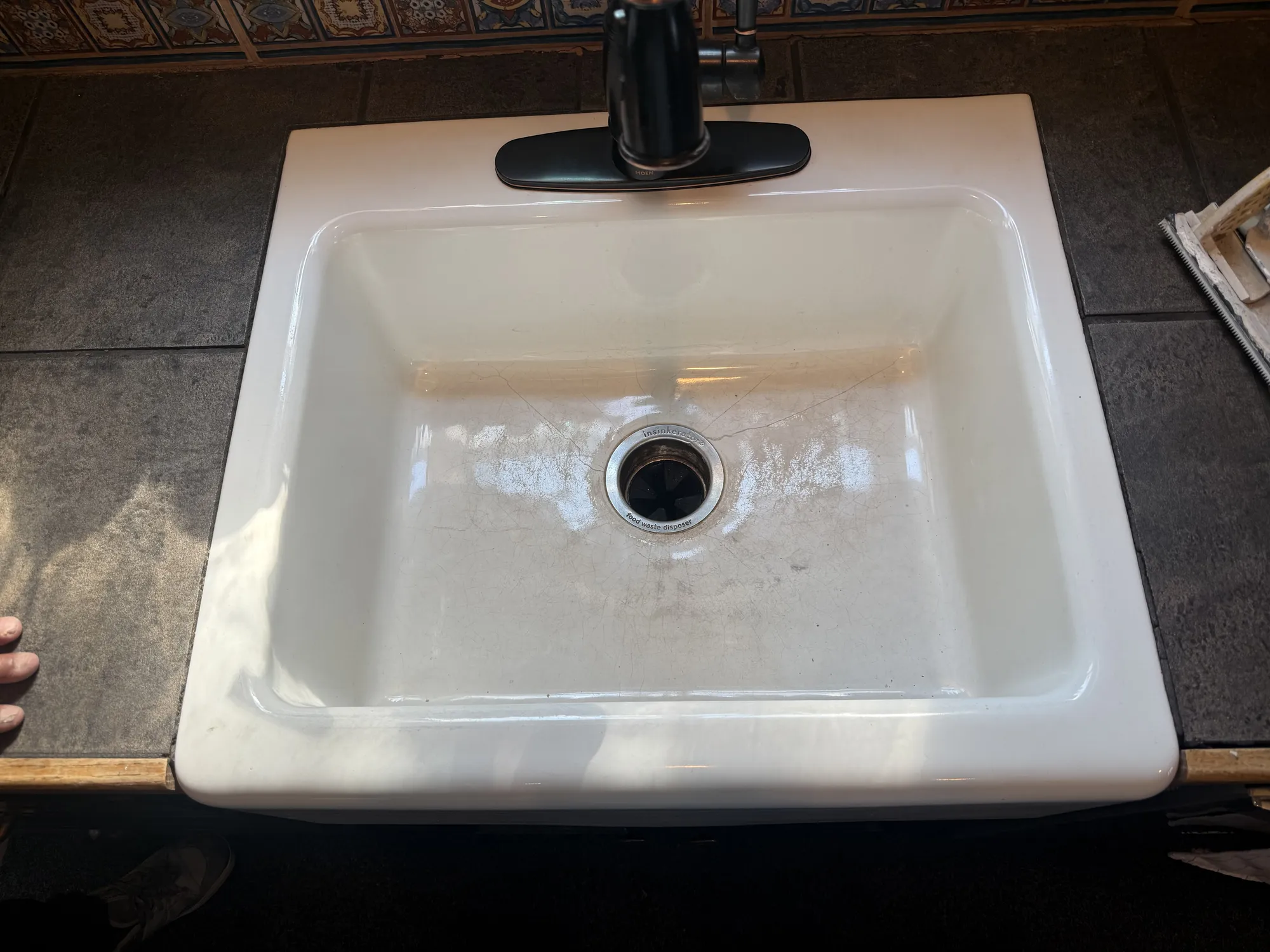 Yellowed farmhouse sink before refinishing