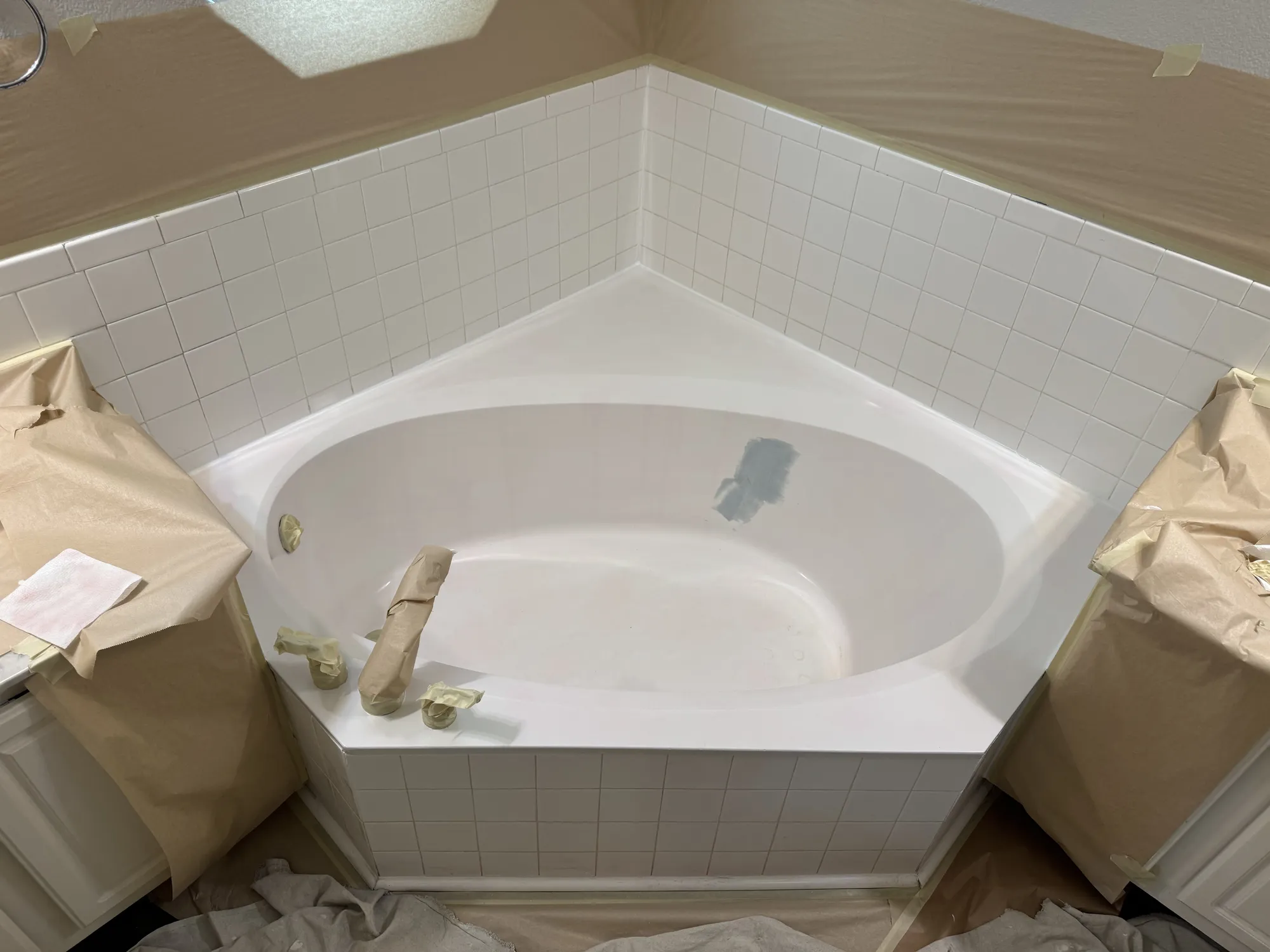 Corner tub masked before refinishing
